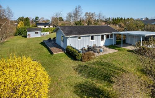an aerial view of a house with a yard at Lovely Home In Melby With Kitchen in Melby