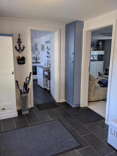 a room with a kitchen and a living room at Maritime Ferienwohnung im Fachwerkhaus in Felm