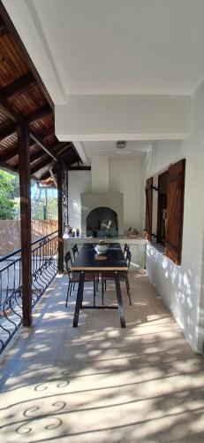 a dining room with a table and a kitchen at Summer house in Urla "Apartment 1" in Urla