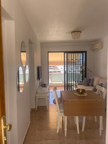 a dining room and living room with a table at San Miguel Apartment Amadores Beach in Puerto Rico de Gran Canaria