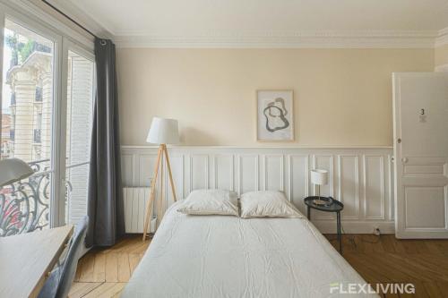 En eller flere senge i et værelse på Flexliving - Room - Lamarck