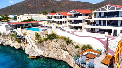 an aerial view of a resort next to the water at Lagun Sunset Resort All Natural Clothing Optional in Lagun