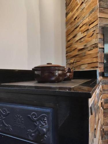 a pot sitting on top of a stove at Chalé rural- hospedagem e experiência! in Gaspar