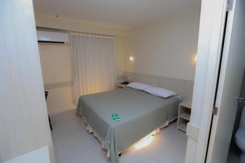 Postel nebo postele na pokoji v ubytování Stay Inn Hotel