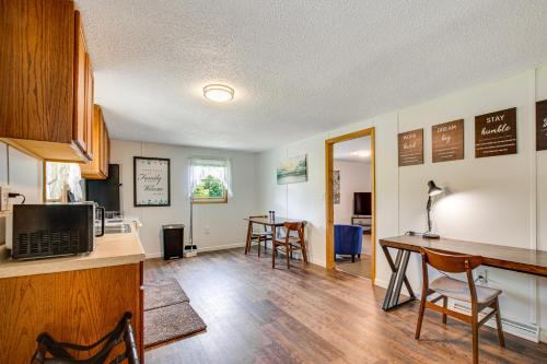 a kitchen and dining room with a table and chairs at Cozy Clearfield Apartment - 3 Mi to Downtown! in Clearfield