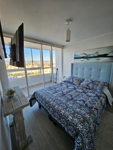 Llit o llits en una habitació de Departamento Edificio Playa Blanca