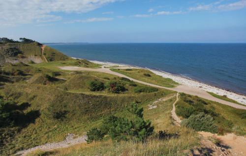 an aerial view of a golf course on a hill next to the ocean at Lovely Home In Nykøbing Sj With Sauna in Nyrup