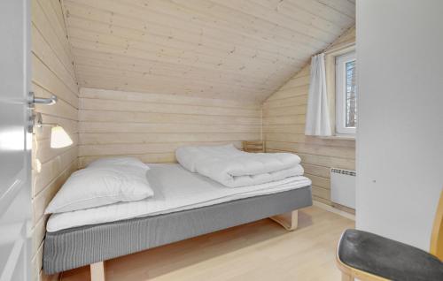 a bedroom with a bed in a small room at Lovely Home In Nykøbing Sj With Sauna in Nyrup