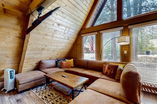 a living room with a couch and a table at On Timbered Time in Munds Park