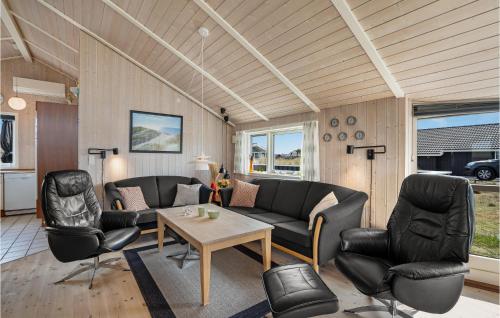 a living room with a couch and chairs and a table at Pet Friendly Home In Hvide Sande in Bjerregård