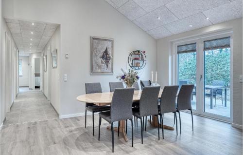 a dining room with a table and chairs at Beautiful Home In Varde With Kitchen in Varde