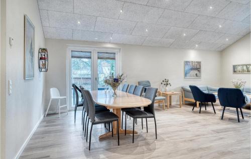 a dining room with a table and chairs at Beautiful Home In Varde With Kitchen in Varde