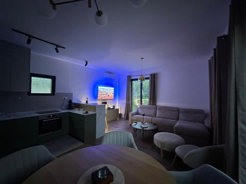 a living room with a couch and a table at Adriatic Dream in Tivat