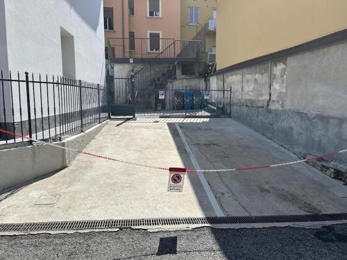 a ramp with a red rope on a building at DolceVita apartment in Como