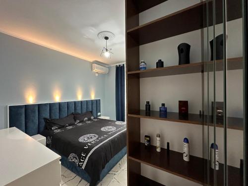 a bedroom with a bed in a room at The Luxe Apartment 22 in Durrës