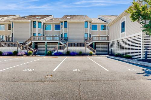 a parking lot in front of a building at Kings Grant --- 40097 E Oceanside Unit 21 in Fenwick Island