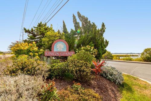 a sign for a kings canyon motel on the side of the road at Kings Grant --- 40097 E Oceanside Unit 21 in Fenwick Island