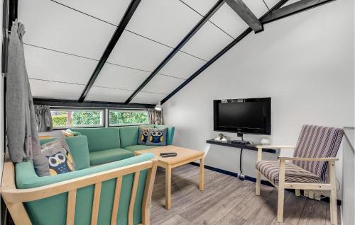 a living room with a couch and a tv at Nice Home In Toftlund With Wifi in Toftlund