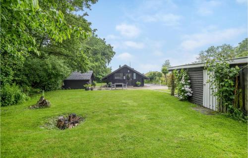 a yard with a house and a building at Amazing Home In Haderslev With Wifi in Haderslev