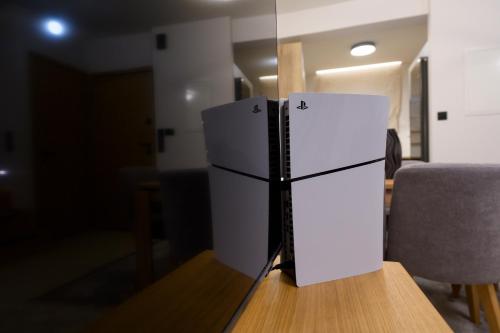 a white refrigerator sitting on top of a wooden table at Next Vision Residence in Anatolí