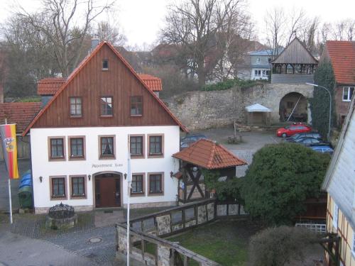 a large white building with a red roof at Hotel Goldflair am Rathaus in Korbach