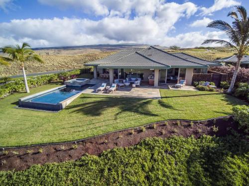 an aerial view of a house with a swimming pool at Hale Keanu in Hapuna Beach