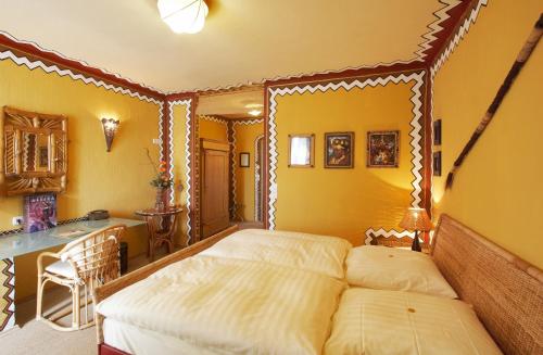 a bedroom with a bed with a wooden frame at Hotel Goldflair am Rathaus in Korbach