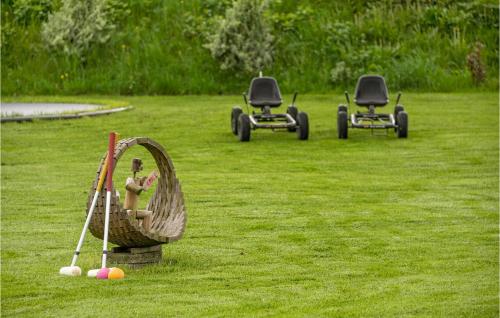 a toy of a person playing a game of baseball at Cozy Home In Rødekro With Wifi in Rødekro