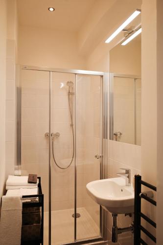 a bathroom with a shower and a sink at Apartment Dusni Superior in Prague