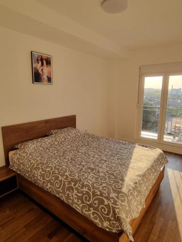Ένα ή περισσότερα κρεβάτια σε δωμάτιο στο Sunset Apartman