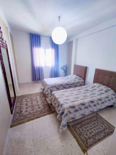 Ένα ή περισσότερα κρεβάτια σε δωμάτιο στο Sunny House