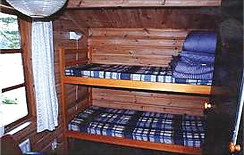 a room with two bunk beds in a boat at Holiday Home Lilla Edet in Lilla Edet