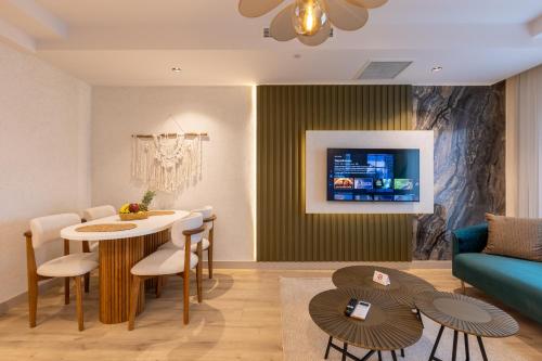 a living room with a table and a couch at Los Suites in Antalya