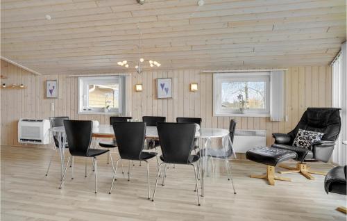 a dining room with a glass table and chairs at Nice Home In Hovborg With Kitchen in Hovborg