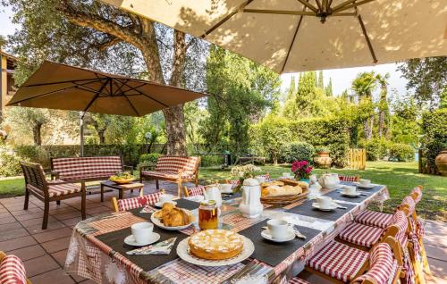 a table with food on top of a patio at Villa Elena in Barbaricina