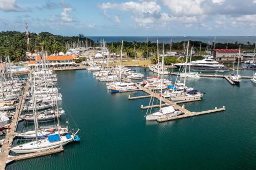 a bunch of boats docked in a harbor at Marina Hotel at Shelter Bay in Colón