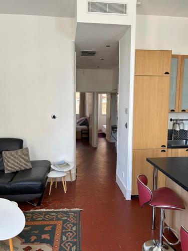 a living room with a couch and a table at Historique vieux port in Marseille