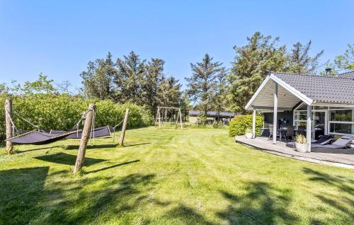 a yard with a playground and a pavilion at 3 Bedroom Amazing Home In Vestervig in Vestervig