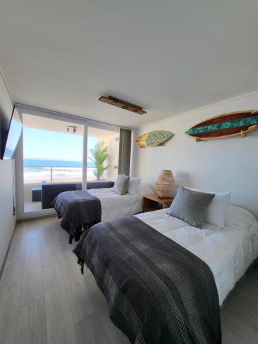 Postel nebo postele na pokoji v ubytování Laguna del Mar La Serena