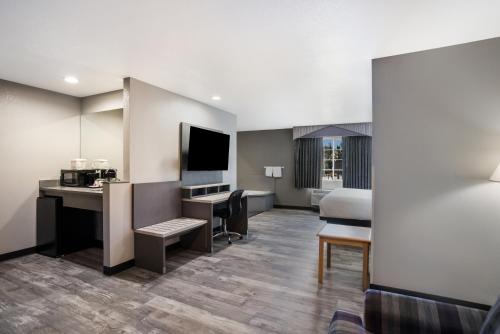 a hotel room with a bed and a desk at SureStay Hotel by Best Western Ukiah in Ukiah