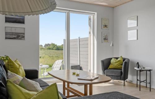 a living room with a table and chairs at Didde in Ribe
