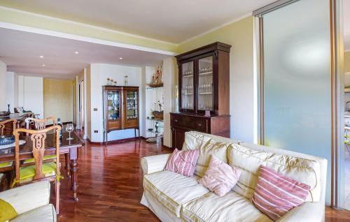 a living room with a couch and a table at 2 Bedroom Nice Apartment In Orbetello in Orbetello