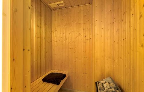 a wooden sauna with a wooden bench in it at Pet Friendly Apartment In Bagenkop in Bagenkop