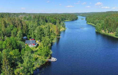 an aerial view of a house on an island in a river at 3 Bedroom Cozy Home In Mellerud in Mellerud