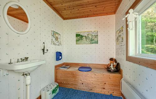 a bathroom with a sink and a bath tub at 3 Bedroom Cozy Home In Mellerud in Mellerud