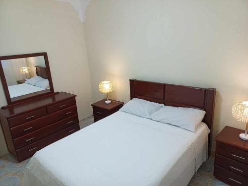 Postel nebo postele na pokoji v ubytování Vivenda Maria Helena