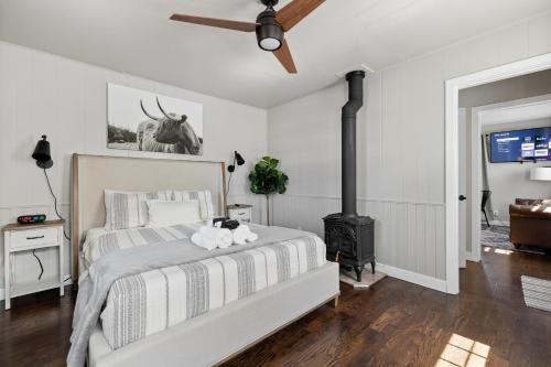 a bedroom with a bed and a fireplace at Spearfish Cottages in Spearfish