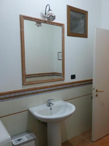a bathroom with a sink and a mirror at Casa Di Lascio in Maratea