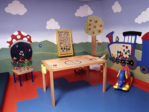 a play room with a toy train and a table at Gasthof Thanner in Brandberg