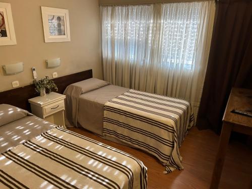 Postel nebo postele na pokoji v ubytování Hotel Rio